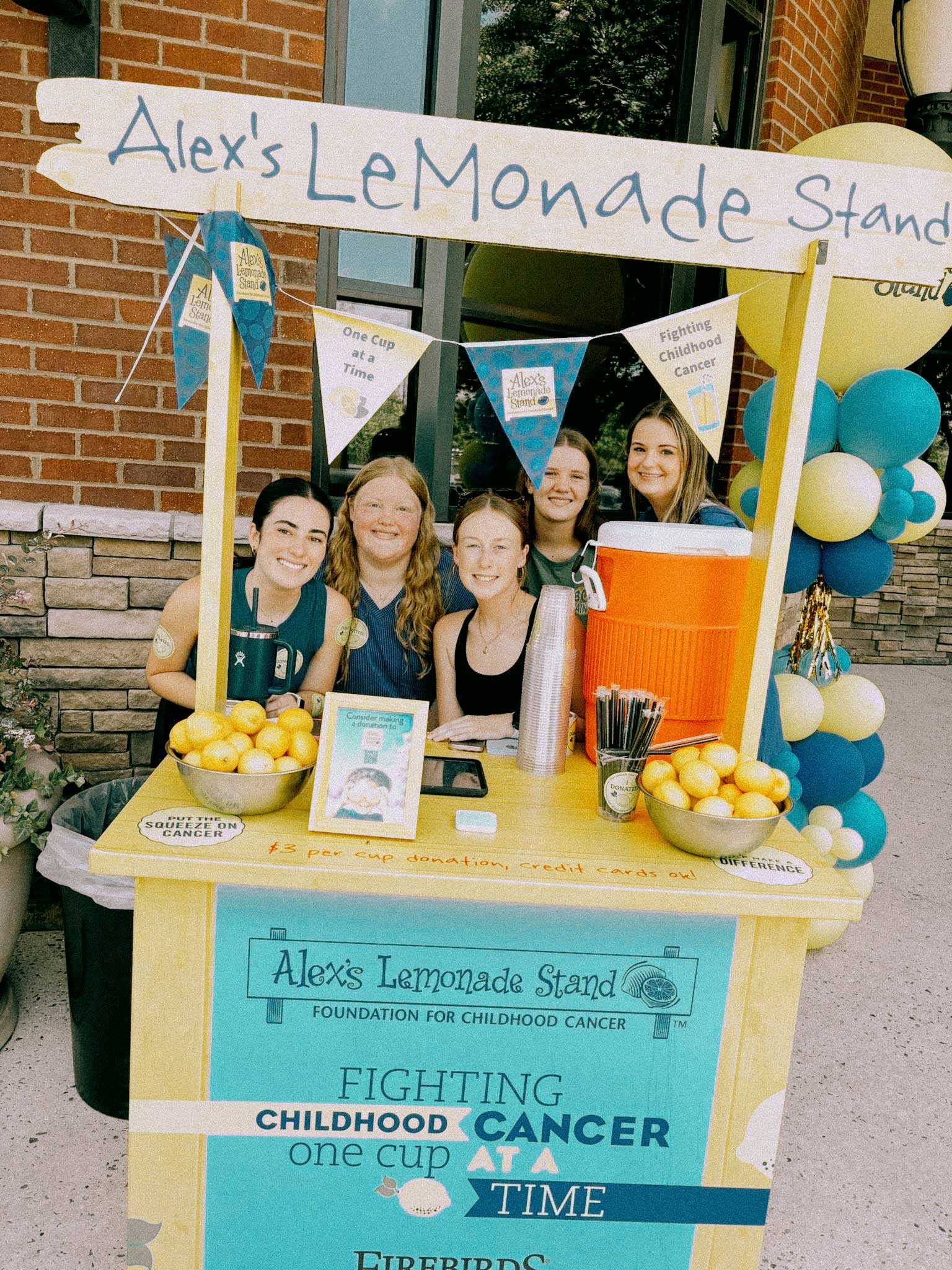 Kids running a neighborhood lemonade stand
