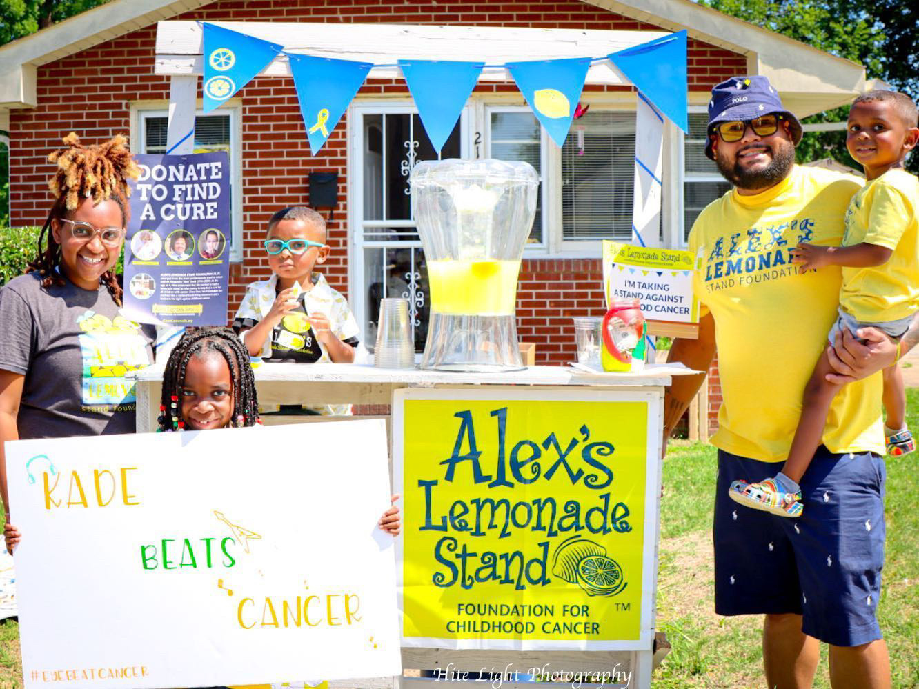 Family running an Alex's Lemonade Stand