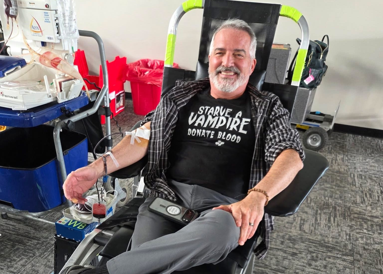 A smiling donor giving blood