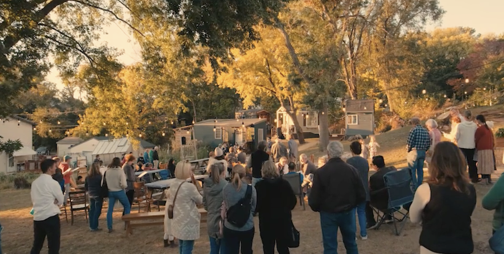 A Sacred Settlement community gathering on church property